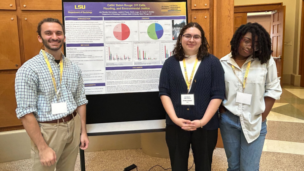 Jay Bonilla and Jaylynn Powe in front of their LSU research poster